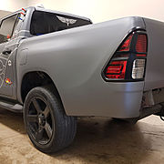 Burgerfuel vehicle repair- new Matte Silver vinyl applied over re-painted rear guard