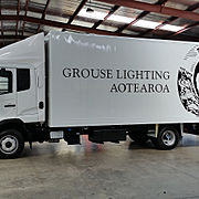 Simple Logo and Lettings on the side panels of a truck